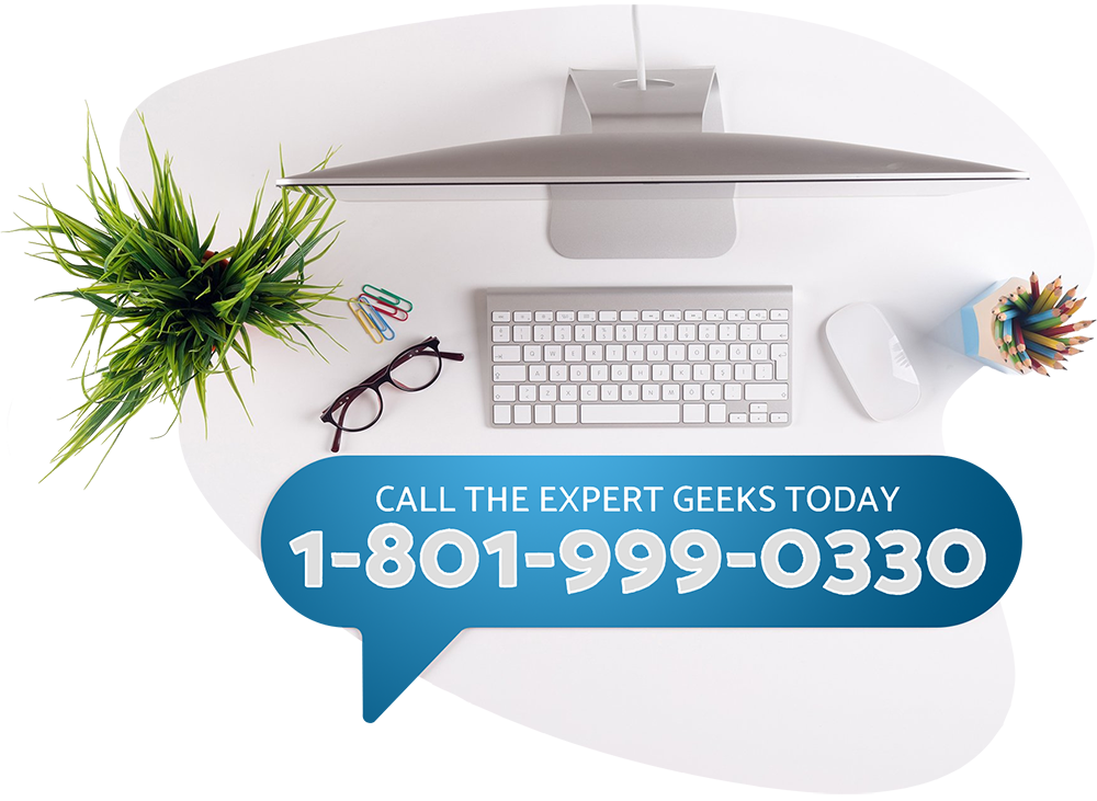 Computer at desk with text reading - Call the expert geeks today 1-801-999-0330